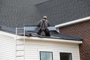 Rainwater flows from roof gutters through a downspout while a homeowner inspects the roof edge.